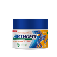 A jar of Arthofix cream, an Ayurvedic herbal pain relief cream, with a blue and orange label and a dark blue cap. The label features a person in a yoga pose and the words ‘Arthofix cream’, ‘herbal pain relief’, ‘action starts in 2 mins’, and ‘50g’. This product represents the theme of organic and Ayurvedic wellness.
